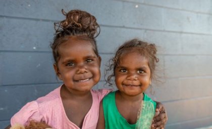Australia has one of the highest rates of rheumatic heart disease in the world. Image: Adobe. Two young Indigenous Australian girls smiling